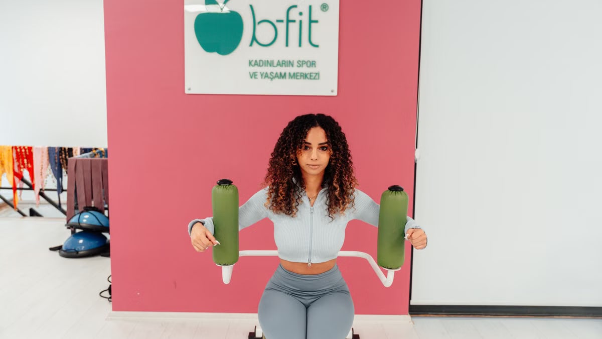 Woman working out in a fitness center in Yalova, Türkiye. Promotes healthy living.